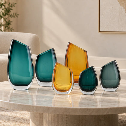 Luxury hand blown glass vase with sculptural curved form and premium decorative styling for sophisticated living spaces