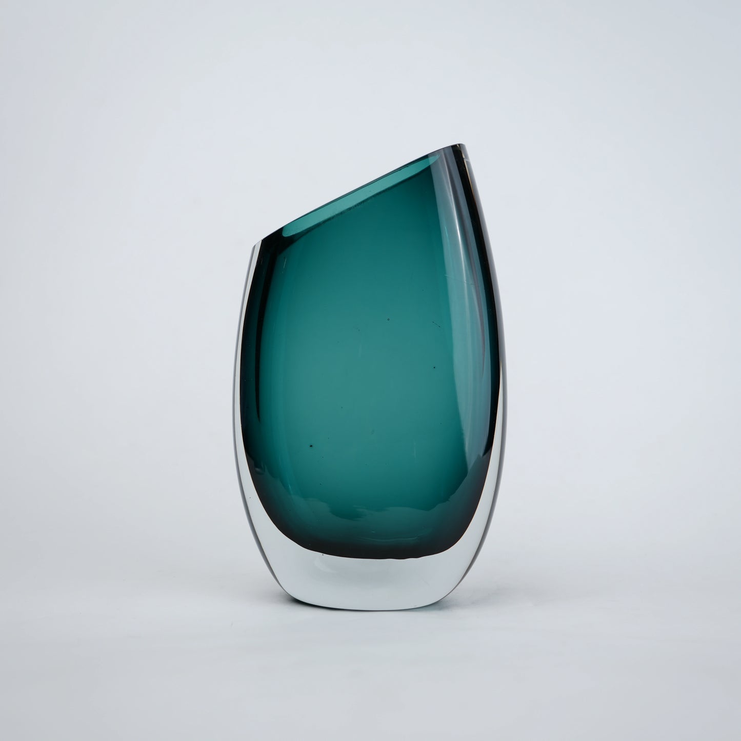 Modern sculptural glass vase collection with rich translucent finish for upscale home decor and designer interiors