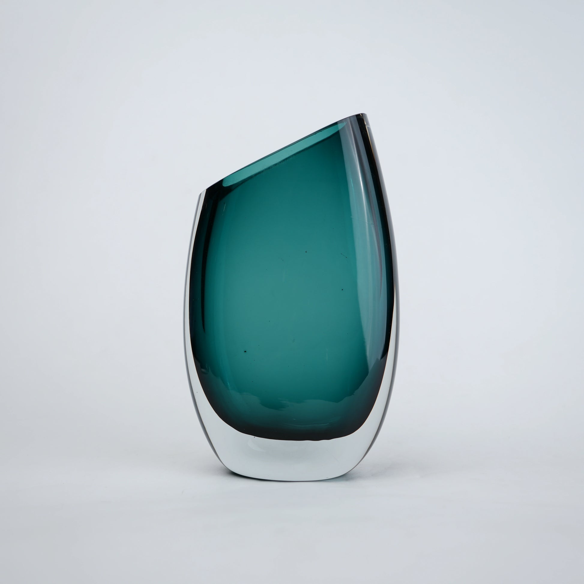 Modern sculptural glass vase collection with rich translucent finish for upscale home decor and designer interiors