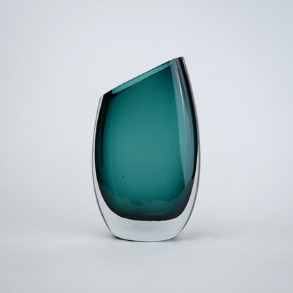 Modern sculptural glass vase collection with rich translucent finish for upscale home decor and designer interiors