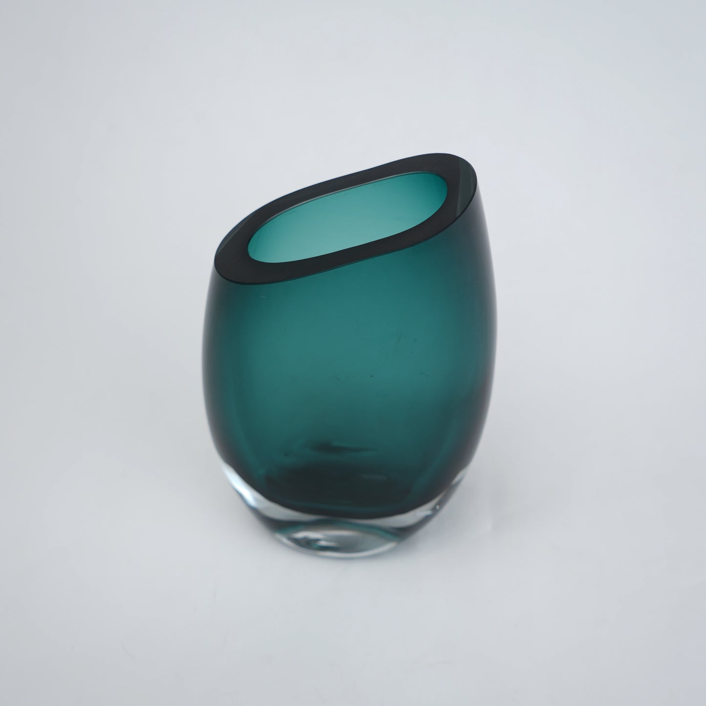 Modern sculptural glass vase collection with rich translucent finish for upscale home decor and designer interiors