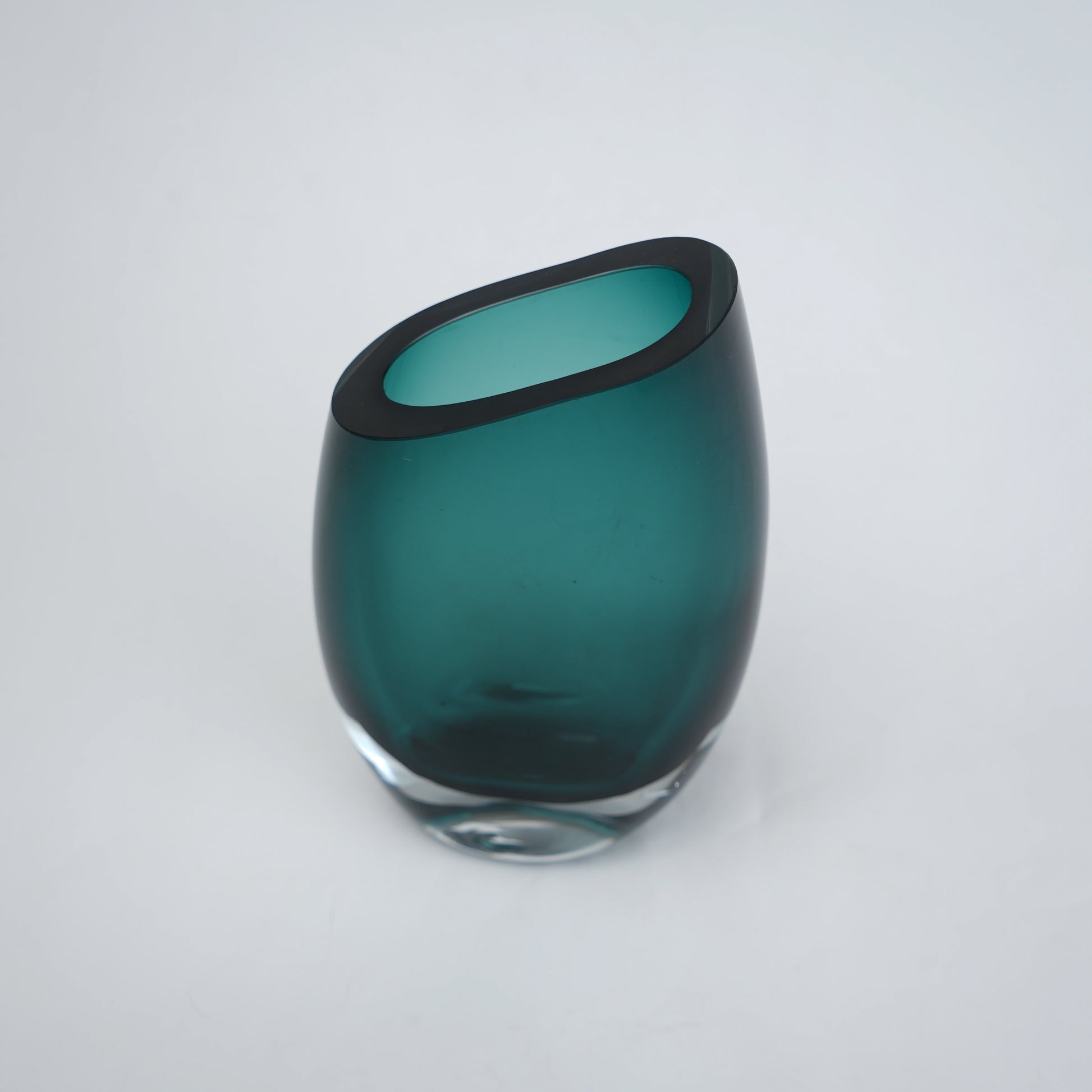 Modern sculptural glass vase collection with rich translucent finish for upscale home decor and designer interiors