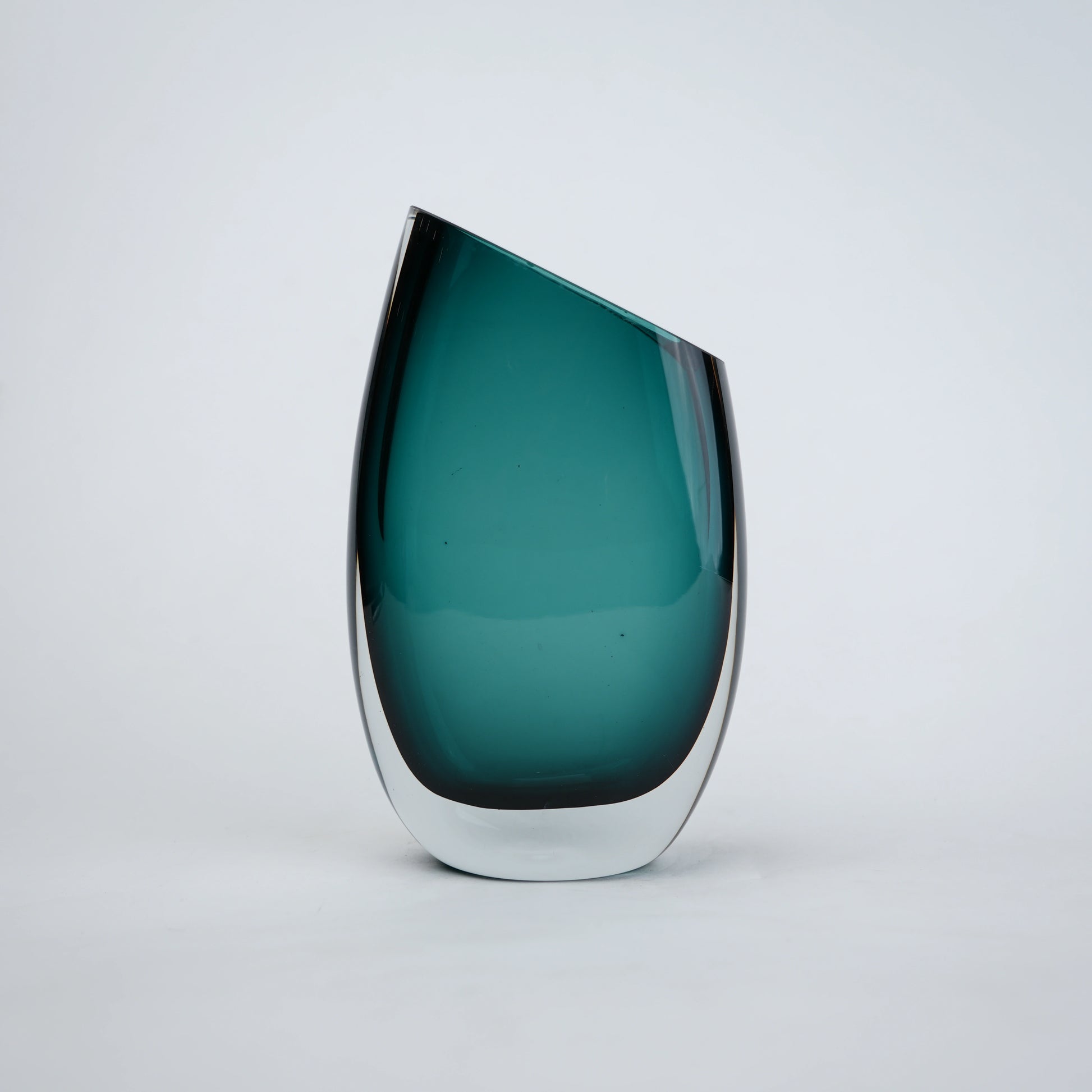 Decorative hand blown glass vase featuring organic asymmetrical form and contemporary luxury aesthetic for stylish homes