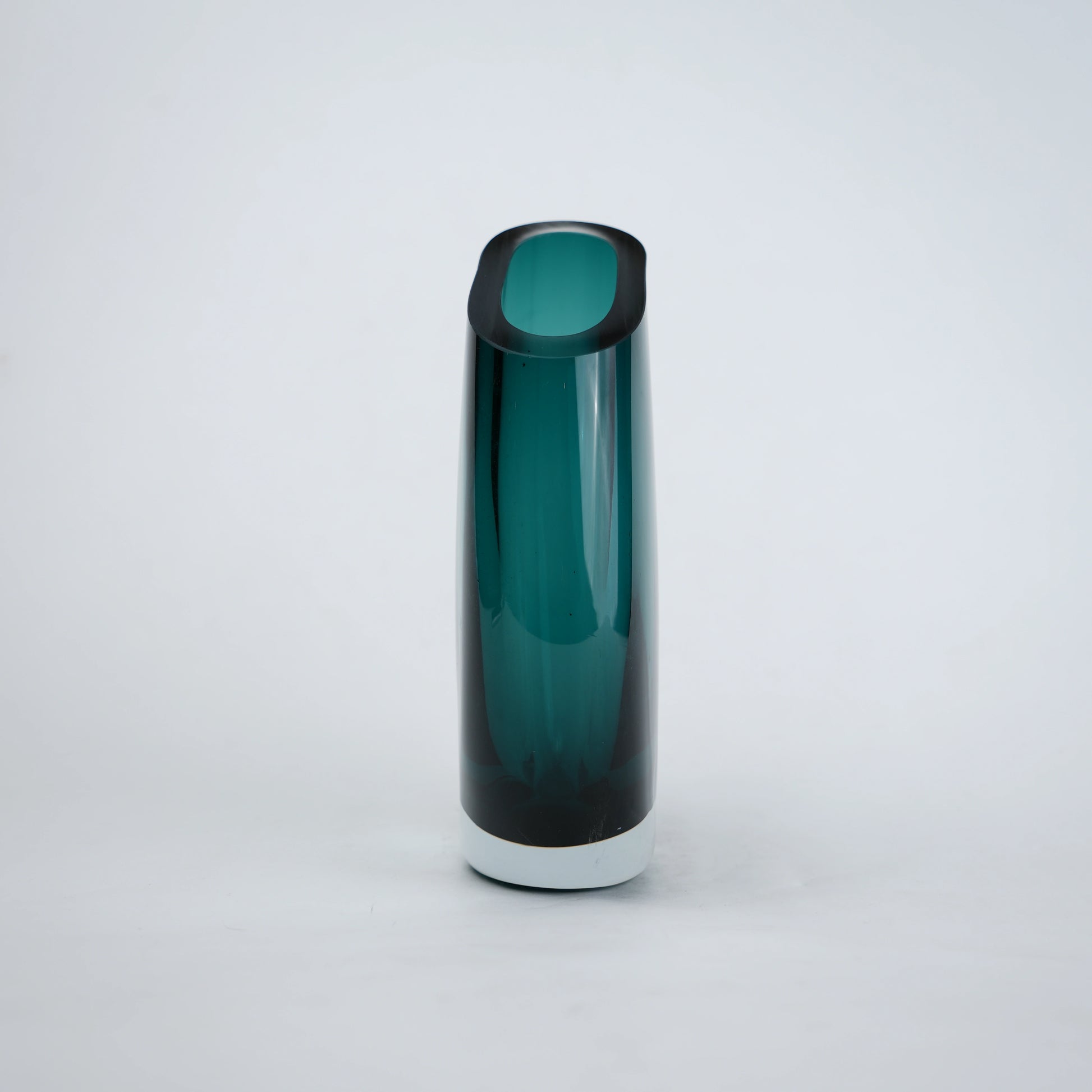 Contemporary colored glass vase designed for floral arrangements, decorative styling and elegant modern living spaces