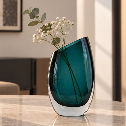 Modern sculptural glass vase collection with rich translucent finish for upscale home decor and designer interiors