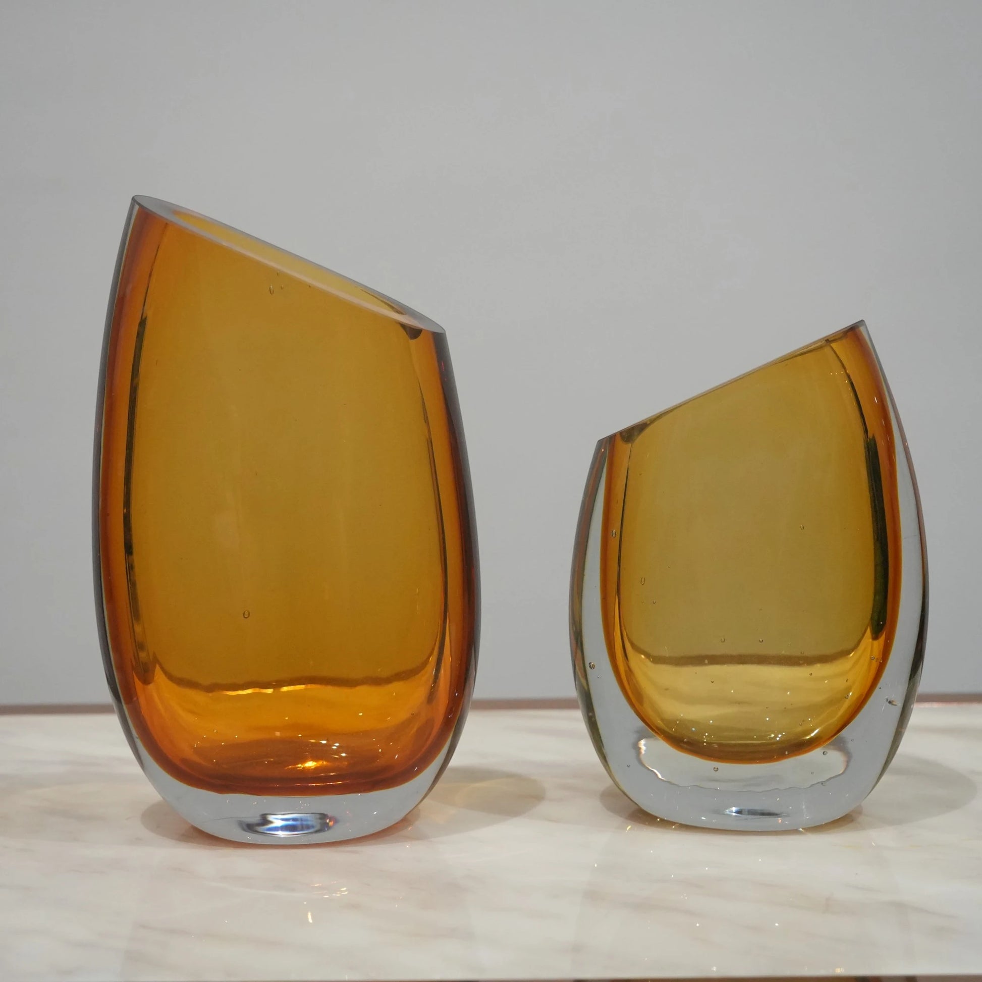 Contemporary colored glass vase designed for floral arrangements, decorative styling and elegant modern living spaces