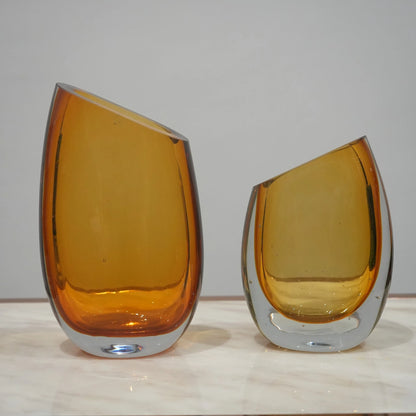 Contemporary colored glass vase designed for floral arrangements, decorative styling and elegant modern living spaces