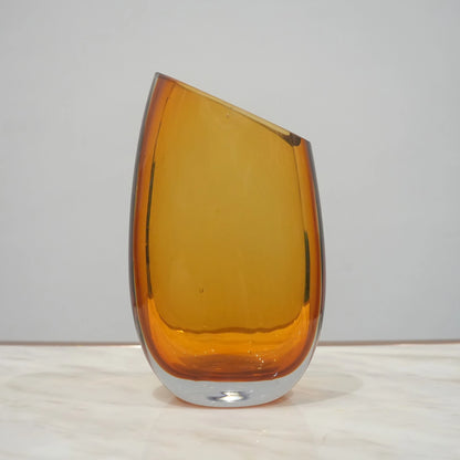 Contemporary colored glass vase designed for floral arrangements, decorative styling and elegant modern living spaces