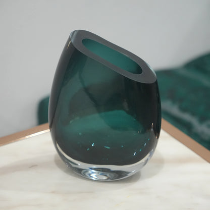 Premium teal glass flower vase with asymmetrical opening and modern luxury styling for elegant interior decor arrangements