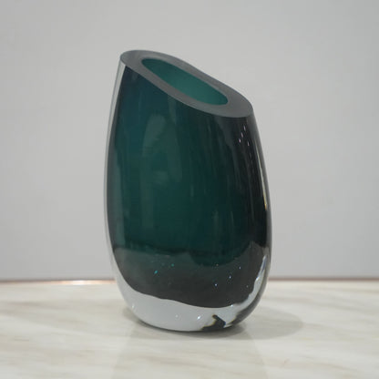 Premium teal glass flower vase with asymmetrical opening and modern luxury styling for elegant interior decor arrangements