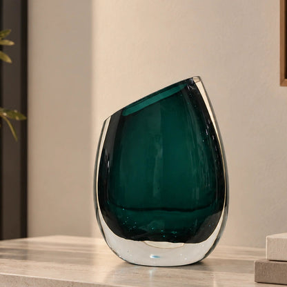 Modern sculptural glass vase collection with rich translucent finish for upscale home decor and designer interiors