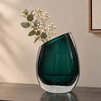Modern sculptural glass vase collection with rich translucent finish for upscale home decor and designer interiors