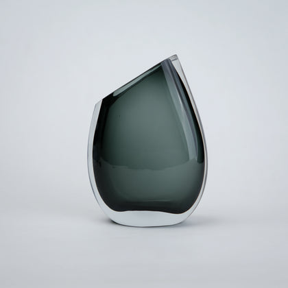 Luxury hand blown glass vase with sculptural curved form and premium decorative styling for sophisticated living spaces
