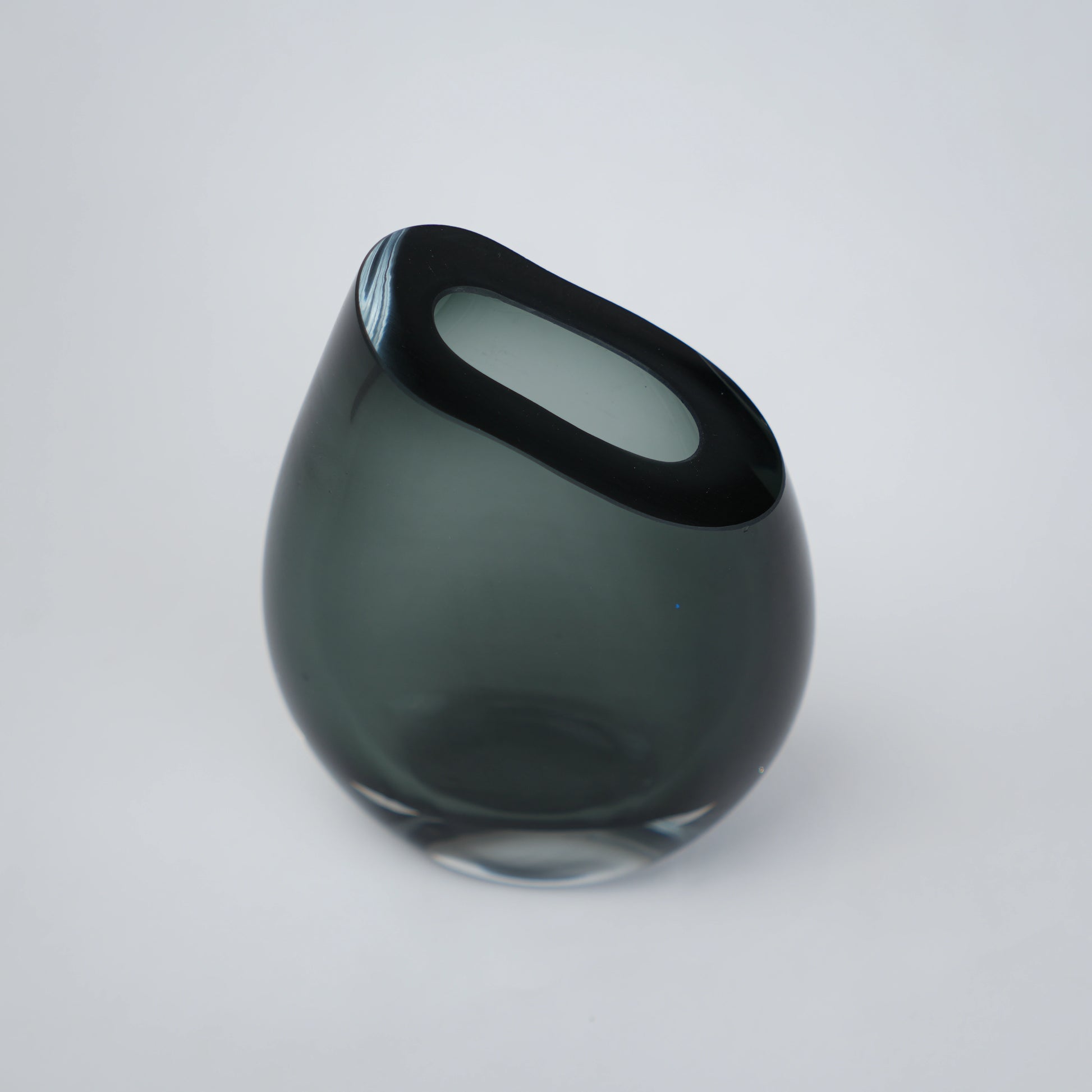 Modern sculptural glass vase collection with rich translucent finish for upscale home decor and designer interiors