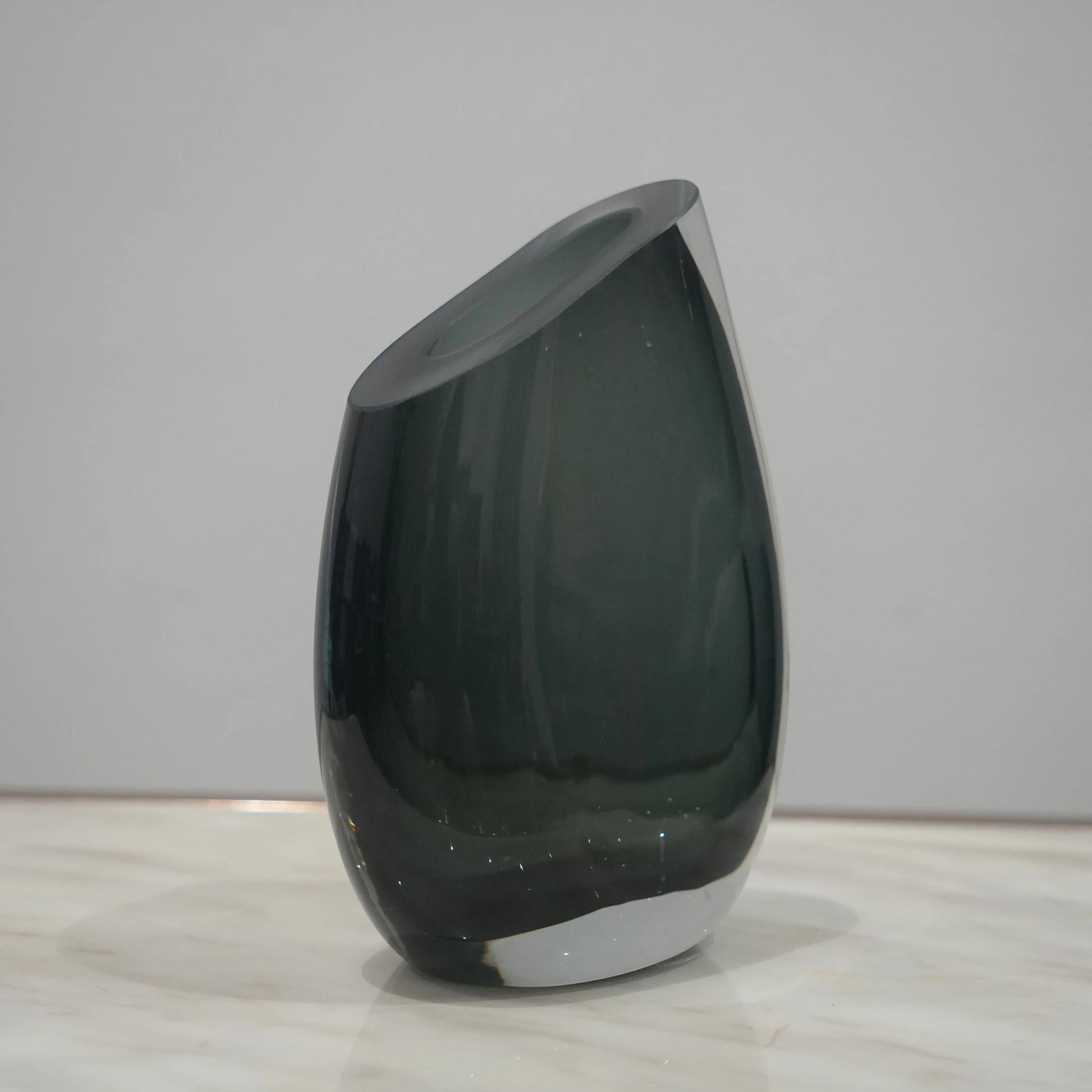 Artistic glass vase set with contemporary tilted silhouette designed for luxury coffee table and console decor styling