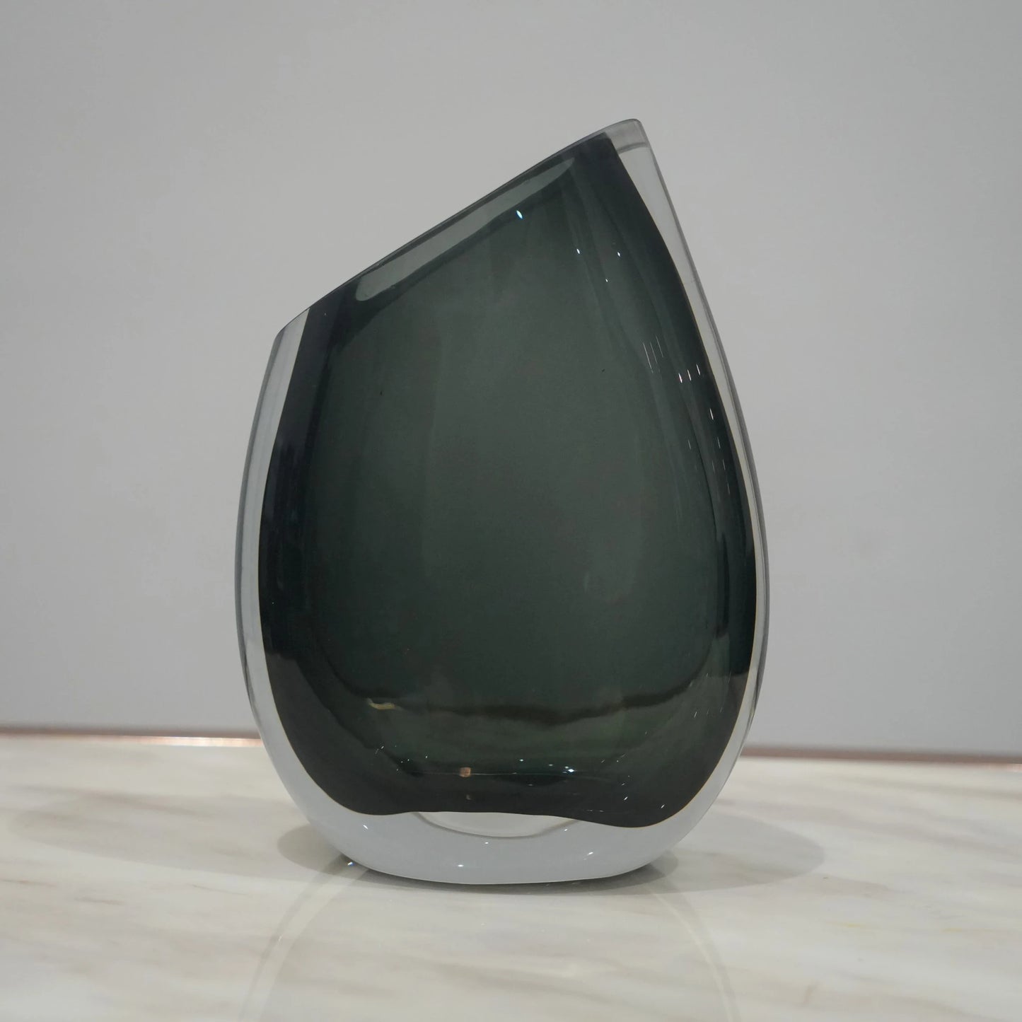 Artistic glass vase set with contemporary tilted silhouette designed for luxury coffee table and console decor styling