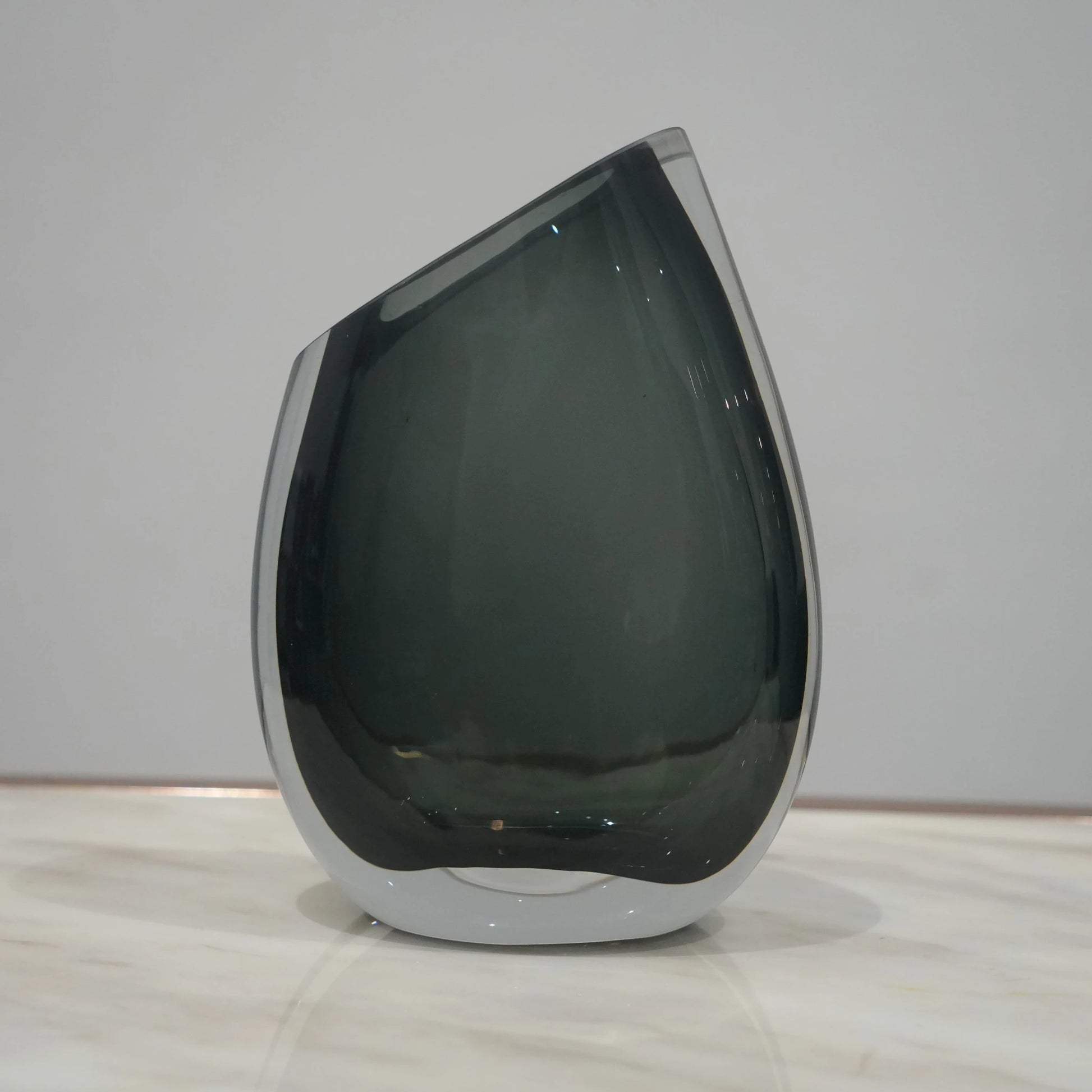 Artistic glass vase set with contemporary tilted silhouette designed for luxury coffee table and console decor styling