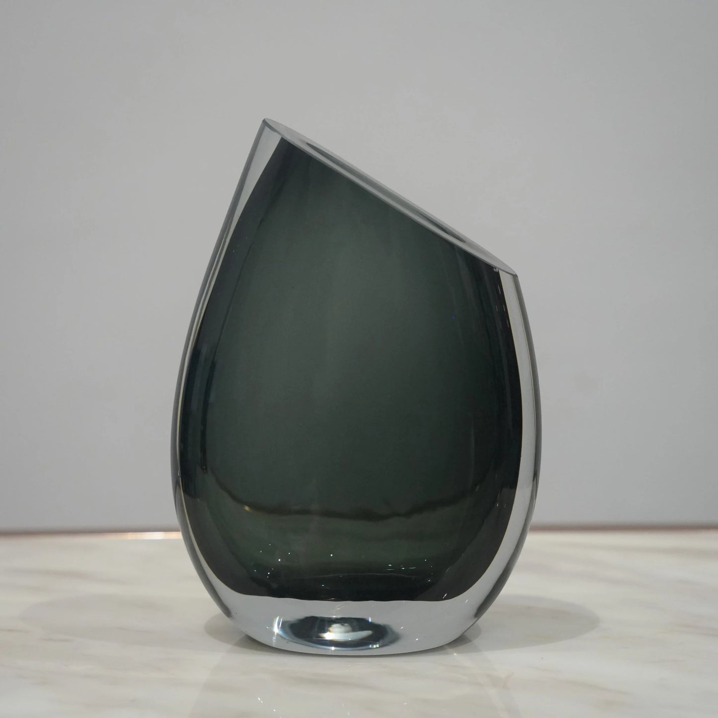 Artistic glass vase set with contemporary tilted silhouette designed for luxury coffee table and console decor styling