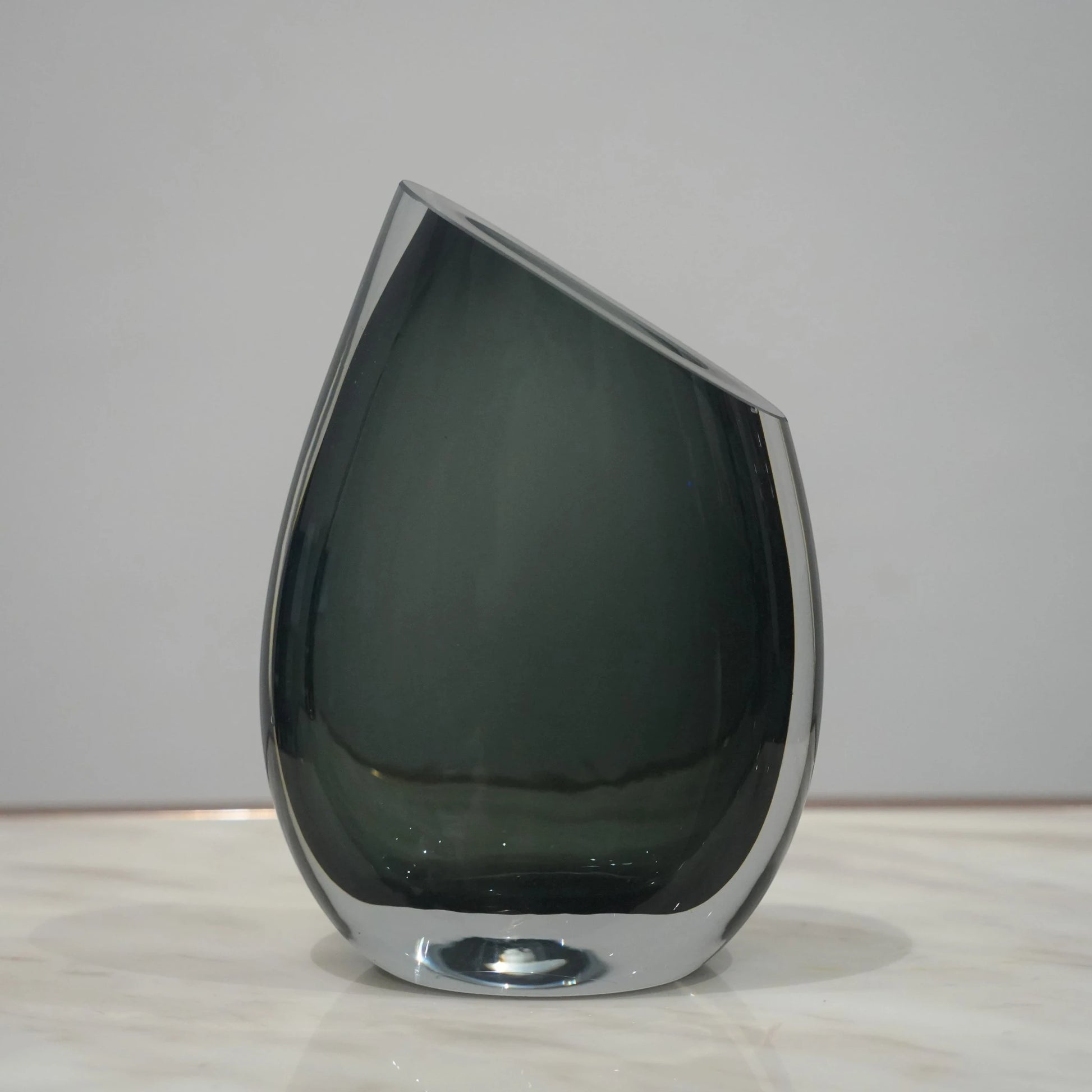 Artistic glass vase set with contemporary tilted silhouette designed for luxury coffee table and console decor styling