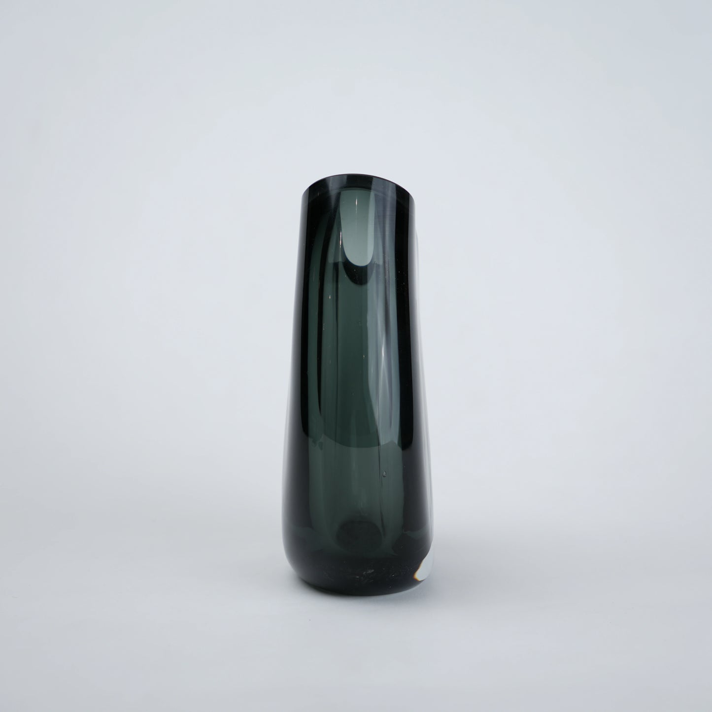 Contemporary colored glass vase designed for floral arrangements, decorative styling and elegant modern living spaces