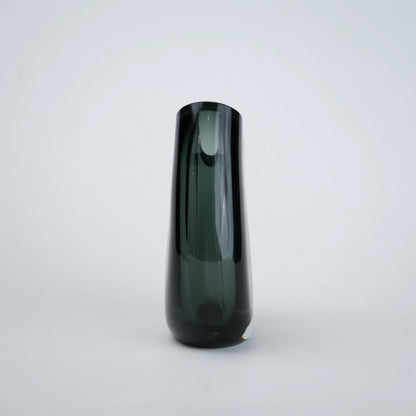 Contemporary colored glass vase designed for floral arrangements, decorative styling and elegant modern living spaces