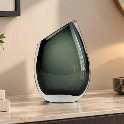 Modern sculptural glass vase collection with rich translucent finish for upscale home decor and designer interiors