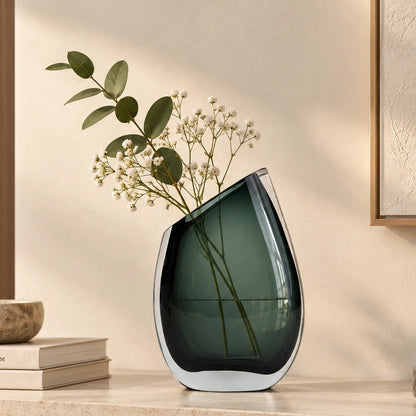 Modern sculptural glass vase collection with rich translucent finish for upscale home decor and designer interiors