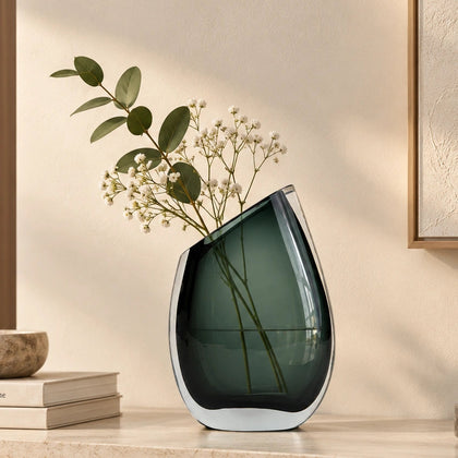 Modern sculptural glass vase collection with rich translucent finish for upscale home decor and designer interiors