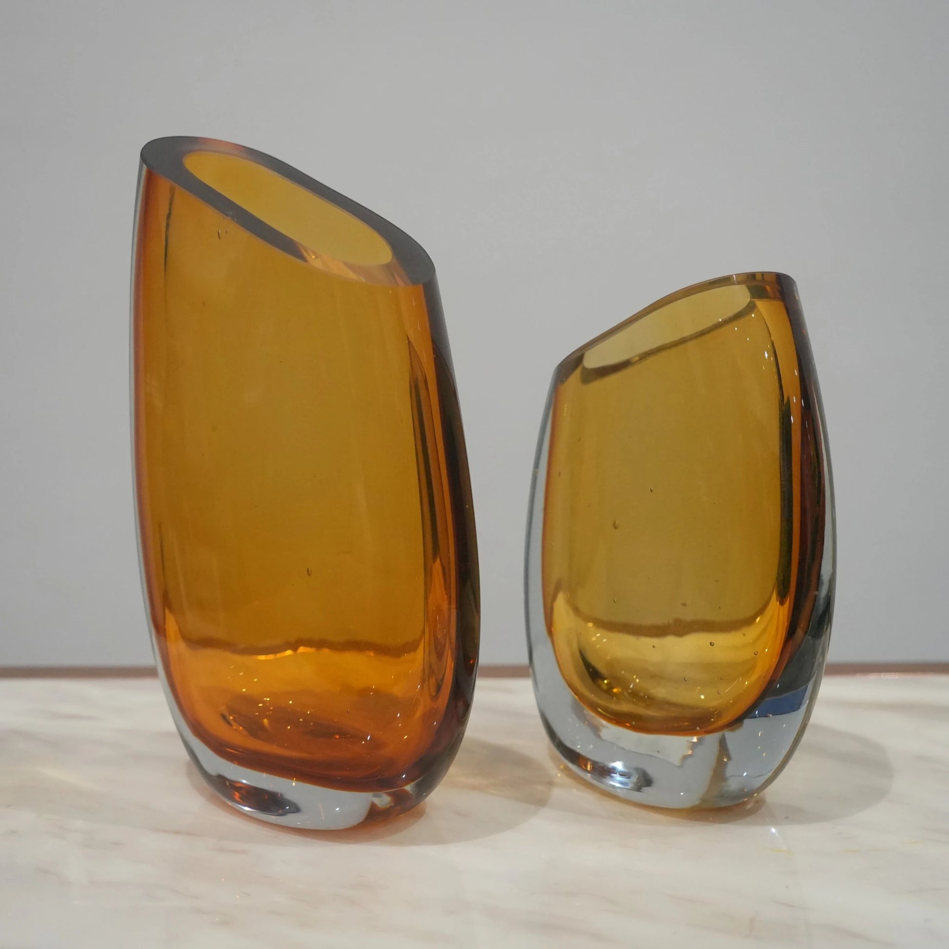 Contemporary colored glass vase designed for floral arrangements, decorative styling and elegant modern living spaces