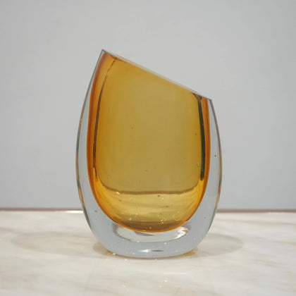 Contemporary colored glass vase designed for floral arrangements, decorative styling and elegant modern living spaces