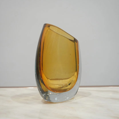Contemporary colored glass vase designed for floral arrangements, decorative styling and elegant modern living spaces