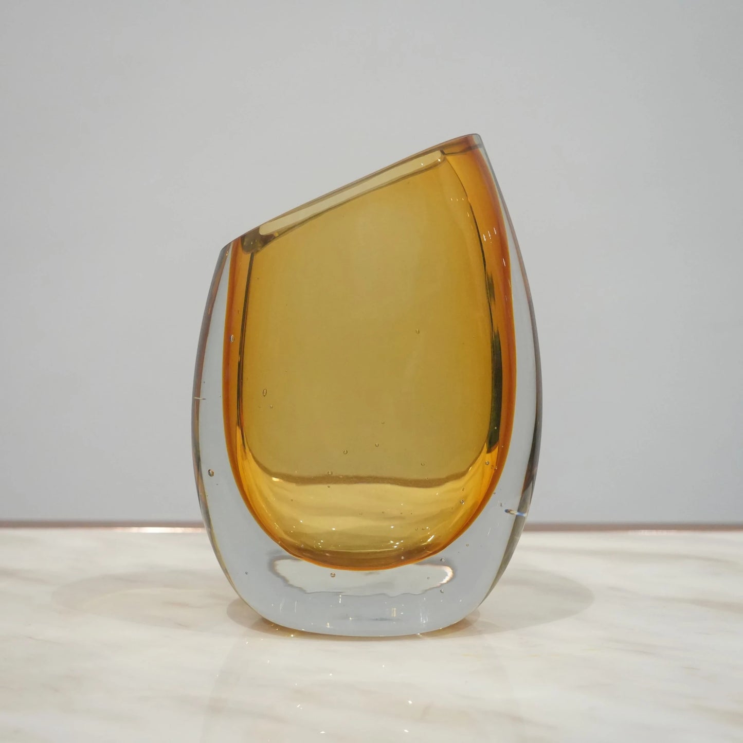 Modern sculptural glass vase collection with rich translucent finish for upscale home decor and designer interiors