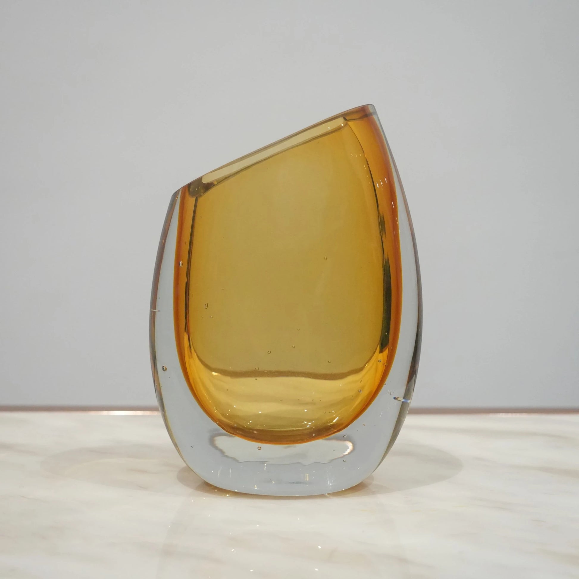 Modern sculptural glass vase collection with rich translucent finish for upscale home decor and designer interiors