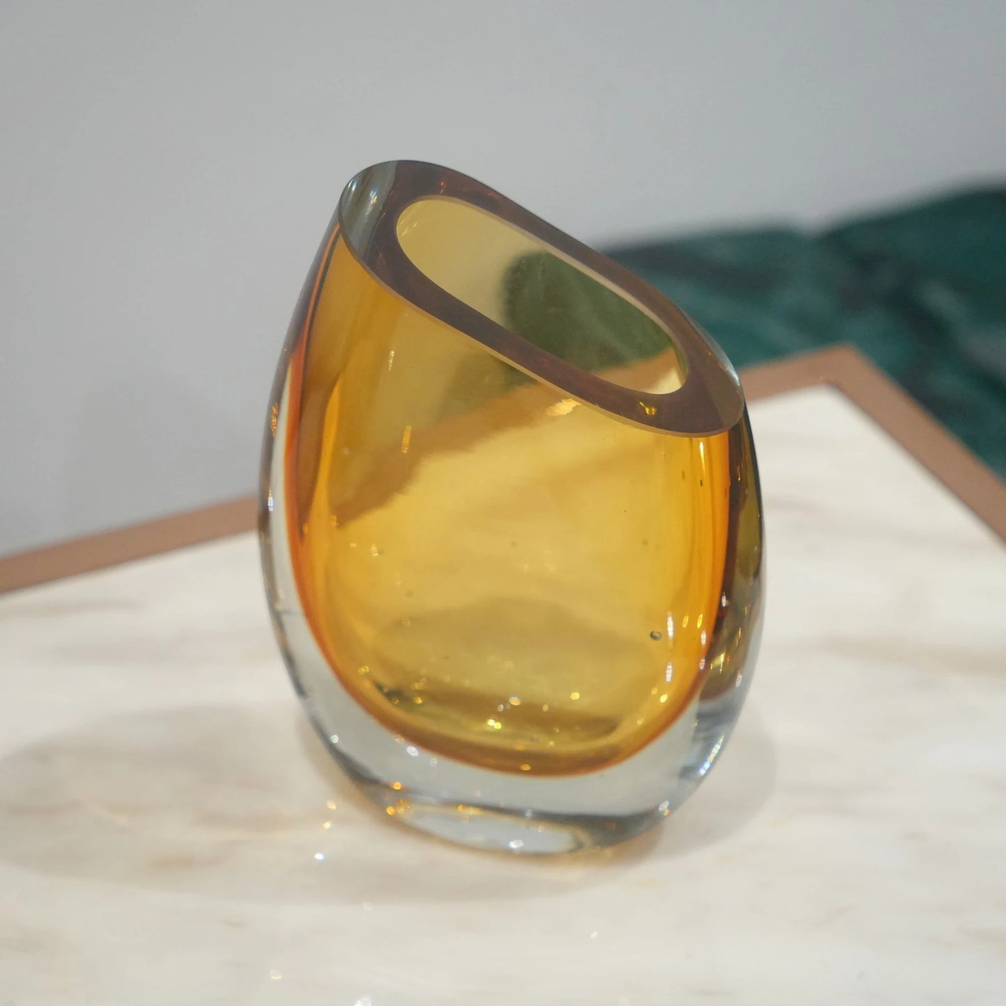 Decorative hand blown glass vase featuring organic asymmetrical form and contemporary luxury aesthetic for stylish homes
