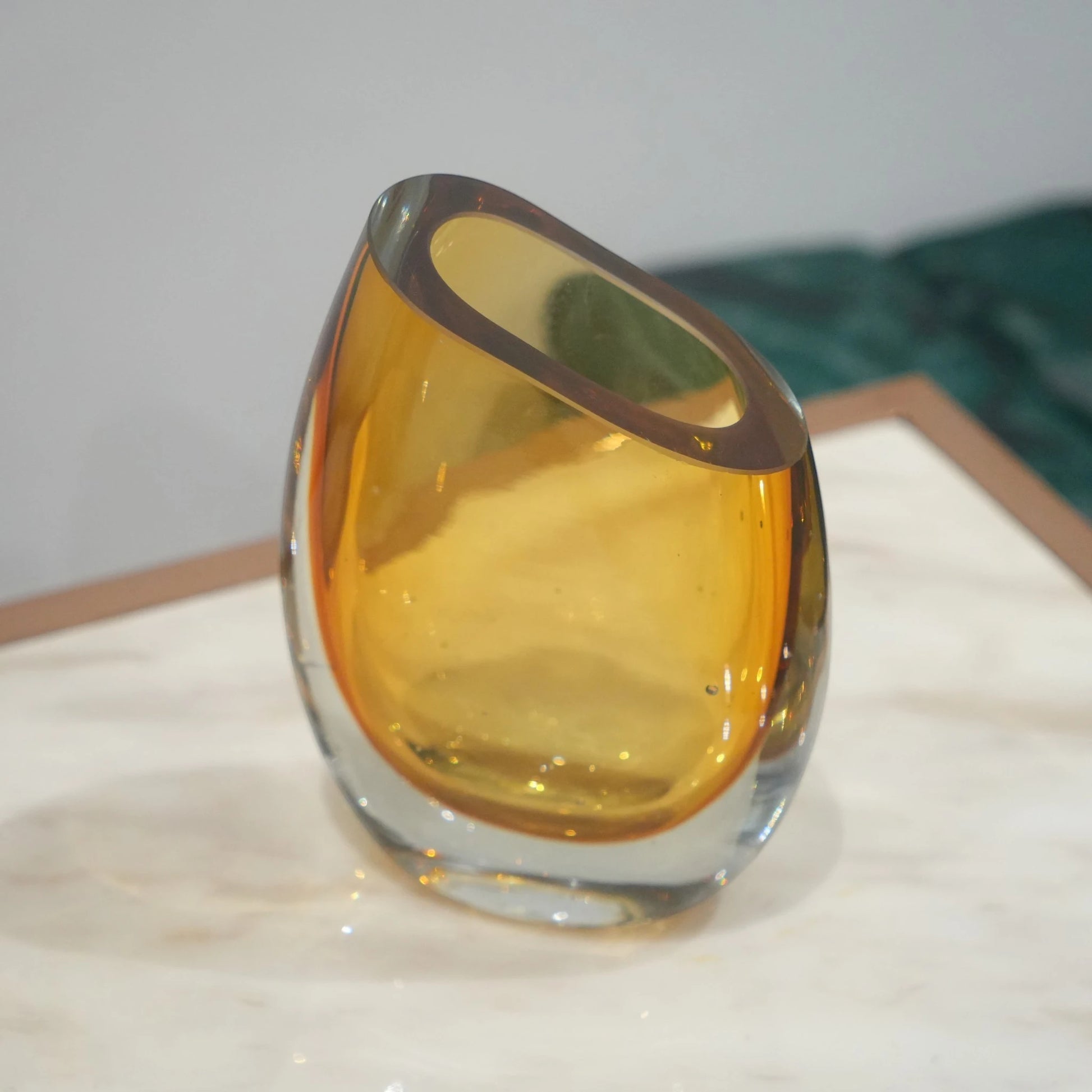 Decorative hand blown glass vase featuring organic asymmetrical form and contemporary luxury aesthetic for stylish homes