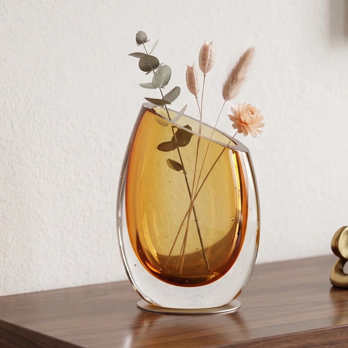 Modern sculptural glass vase collection with rich translucent finish for upscale home decor and designer interiors