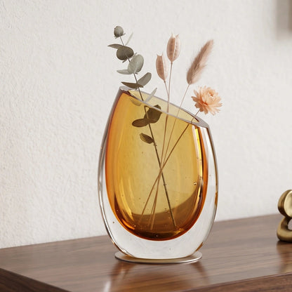 Modern sculptural glass vase collection with rich translucent finish for upscale home decor and designer interiors