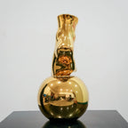 Modern decorative gold vase with foot silhouette and mirror finish