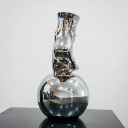 Modern decorative silver vase with foot silhouette and mirror finish