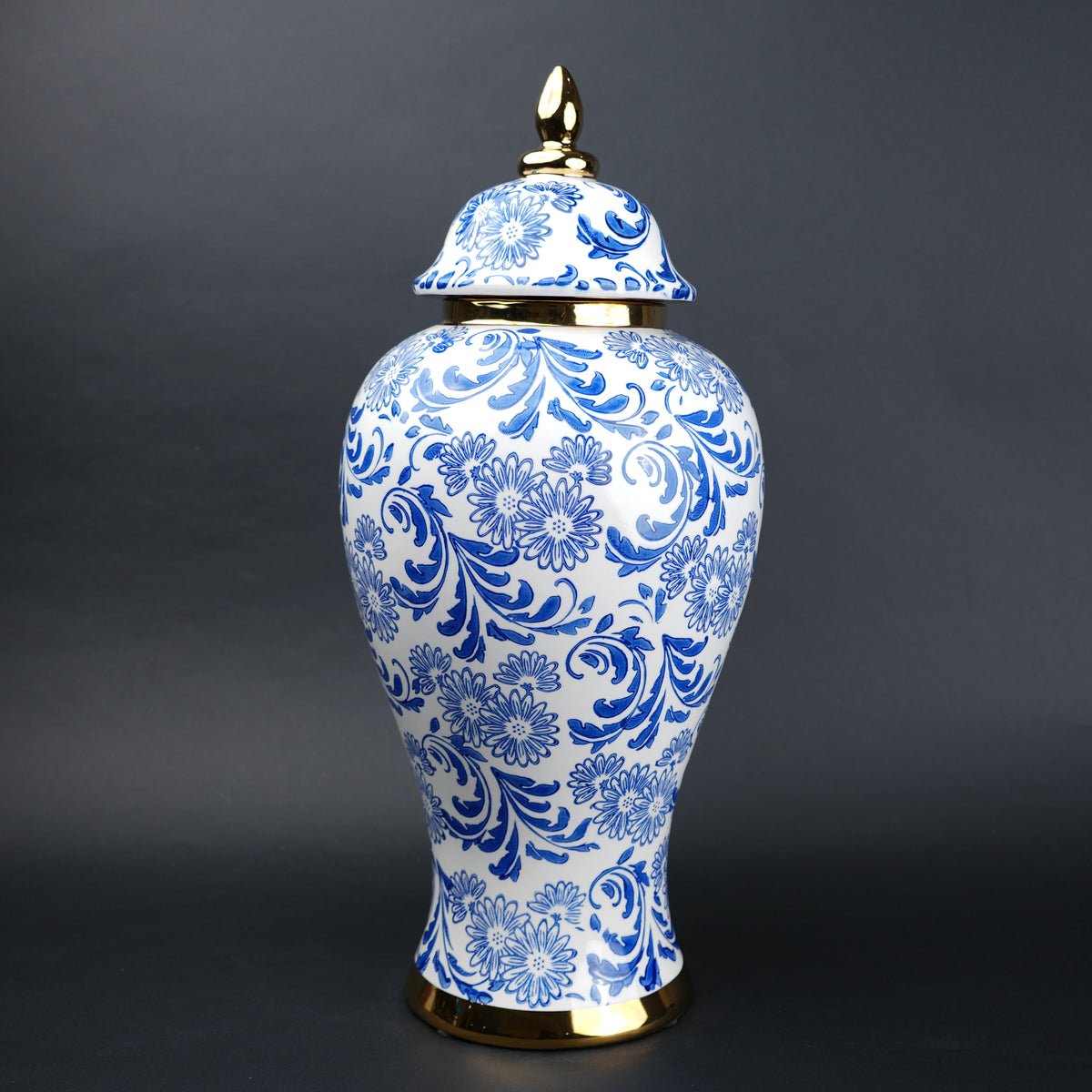 Blue and white ceramic jar with floral design and lid for home decor styling