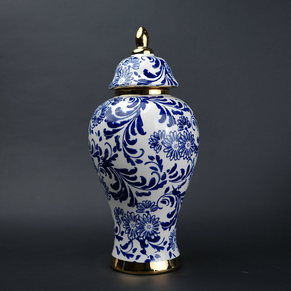 Blue and white ceramic jar with floral design and lid for home decor styling