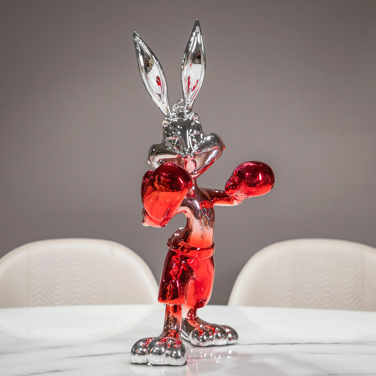 Resin bunny boxer figurine with chrome black finish and scarlet red gloves and shorts