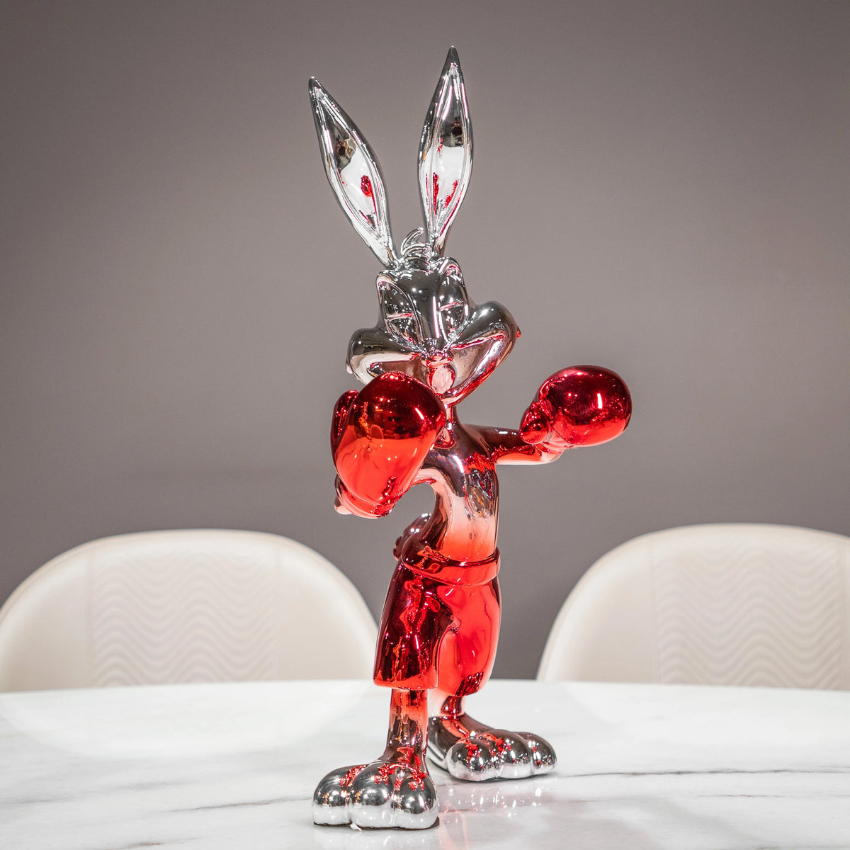 Resin bunny boxer figurine with chrome black finish and scarlet red gloves and shorts