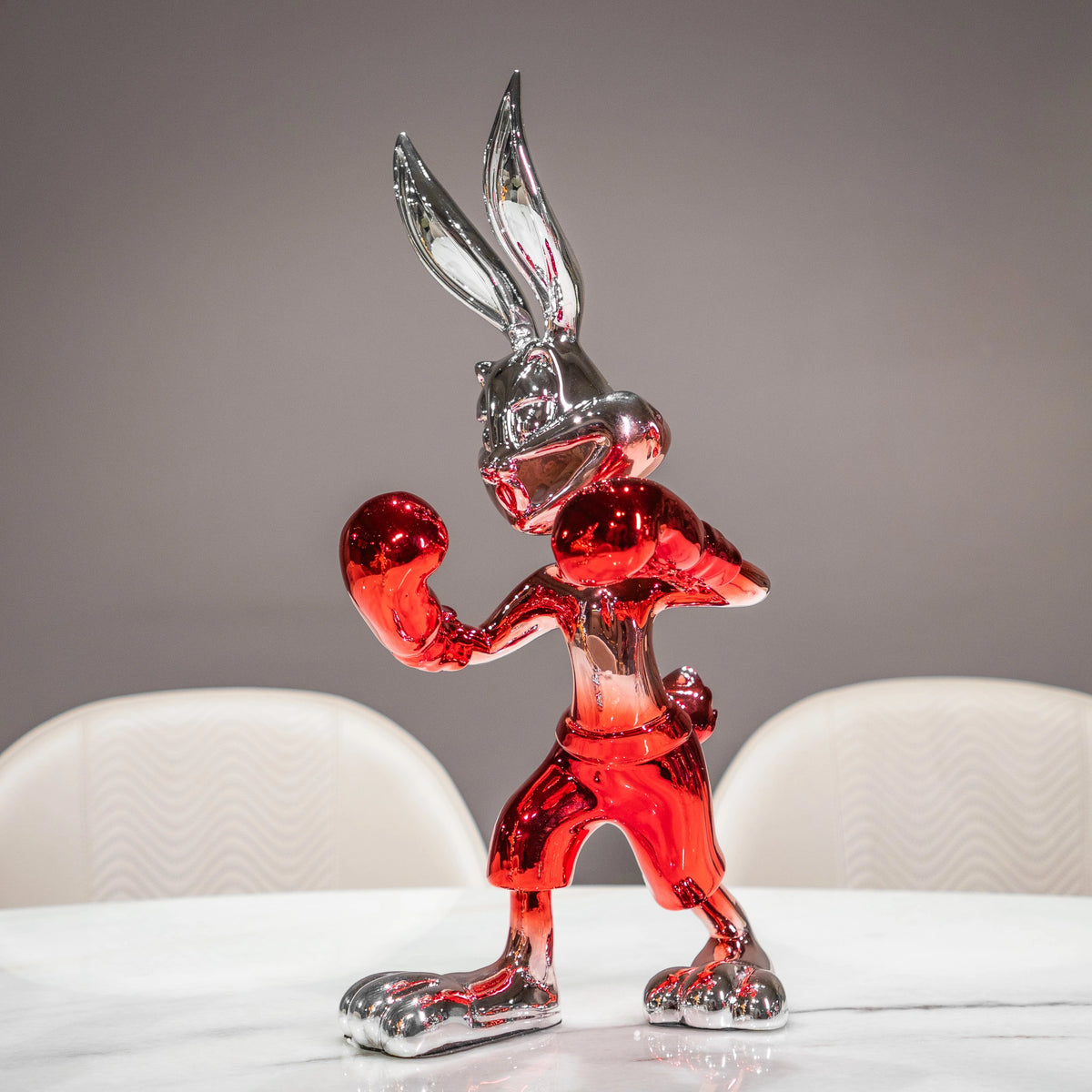 Resin bunny boxer figurine with chrome black finish and scarlet red gloves and shorts