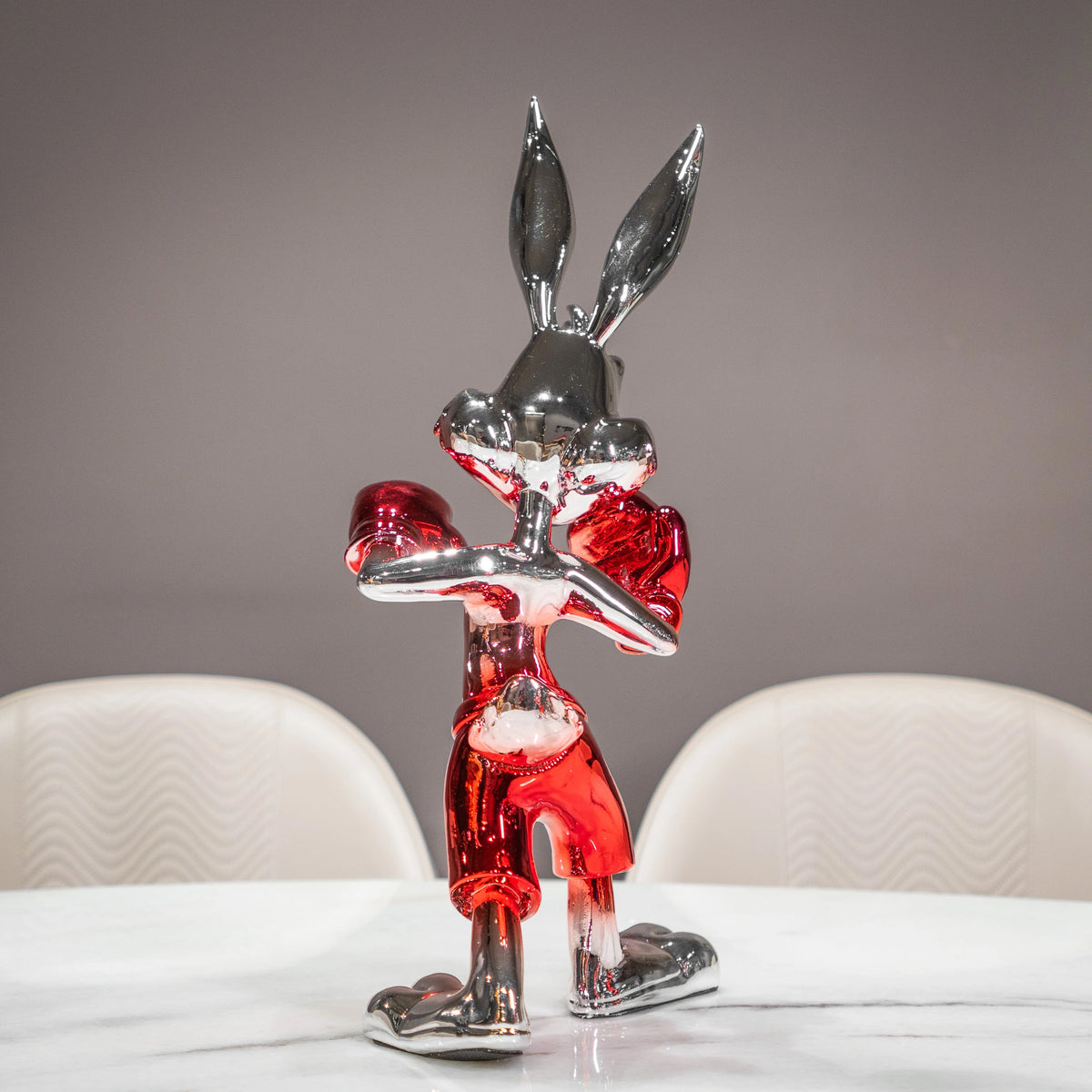 Resin bunny boxer figurine with chrome black finish and scarlet red gloves and shorts