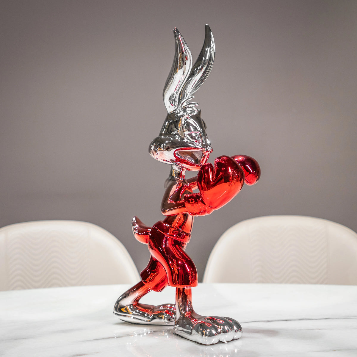 Resin bunny boxer figurine with chrome black finish and scarlet red gloves and shorts