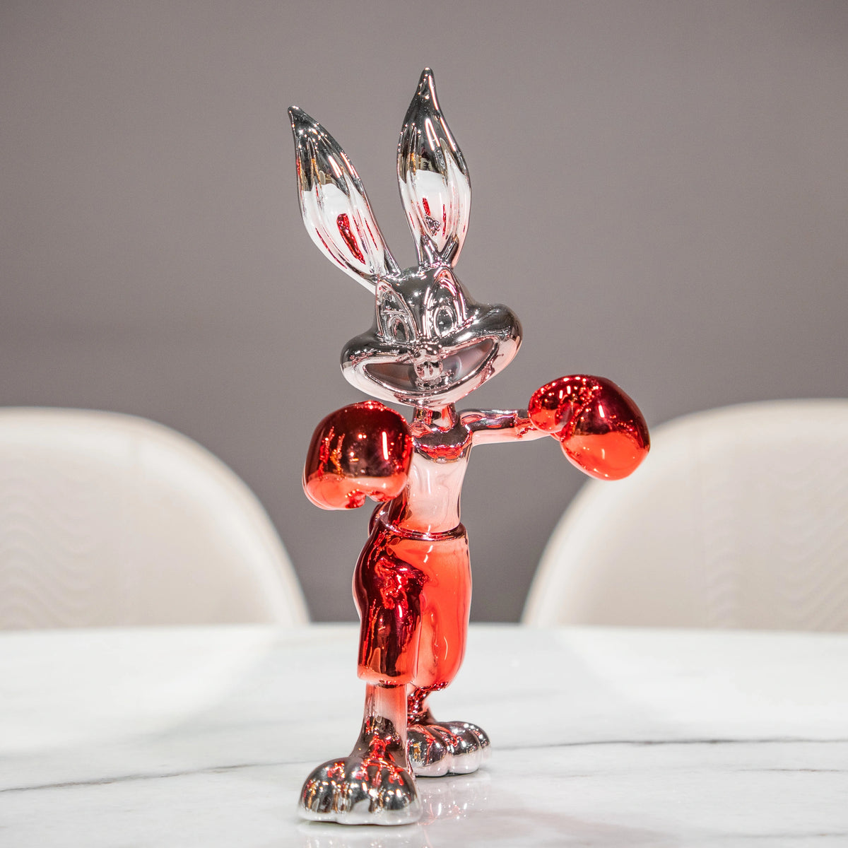 Resin bunny boxer figurine with chrome black finish and scarlet red gloves and shorts