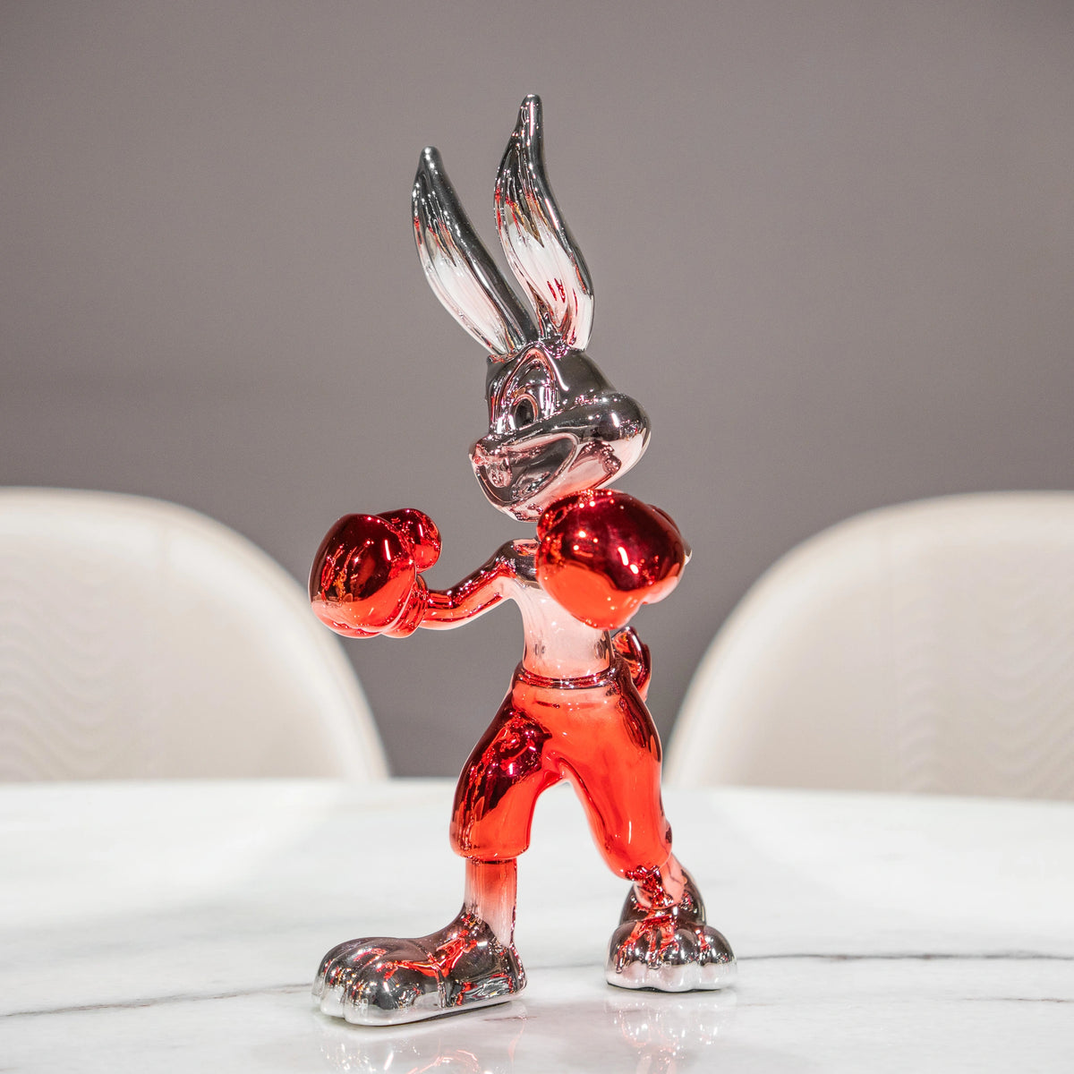 Resin bunny boxer figurine with chrome black finish and scarlet red gloves and shorts