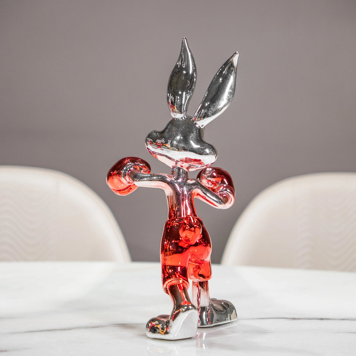 Resin bunny boxer figurine with chrome black finish and scarlet red gloves and shorts