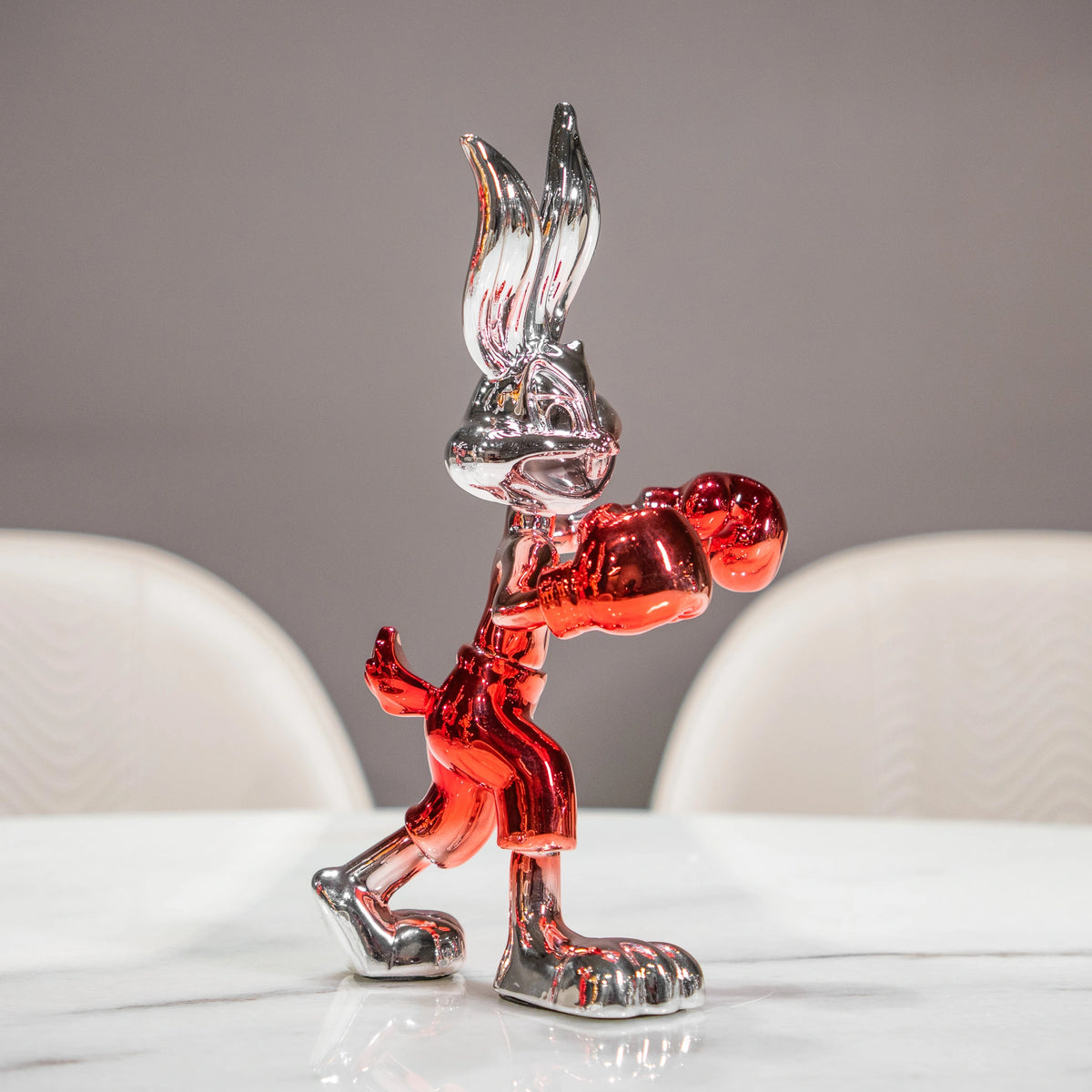Resin bunny boxer figurine with chrome black finish and scarlet red gloves and shorts